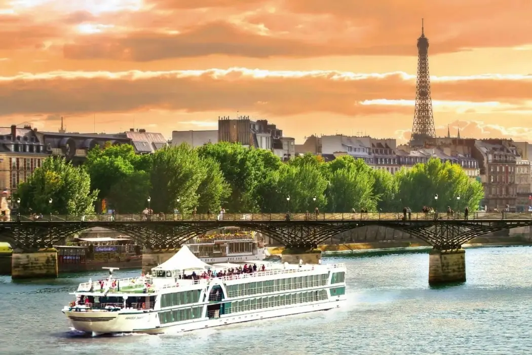  Sunset cruise on Seine River with Eiffel Tower in view.